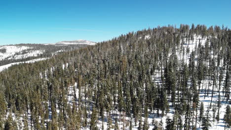 Aerial-shot-of-snow-covered-Sierra-Nevada-wilderness-and-mountains