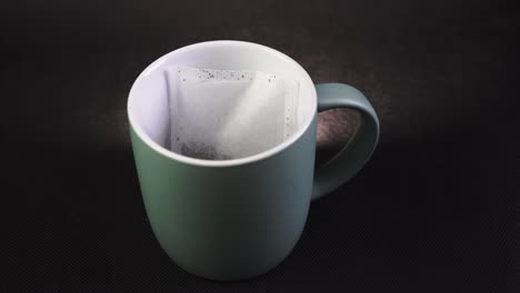 Putting-a-Tea-bag-into-a-mug