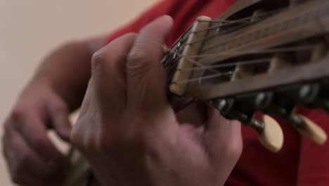Close-up-of-a-musician-picking-on-a-classical-guitar
