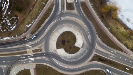 AERIAL:-Timelapse-of-Roundabout-With-Motor-Vehicles-Entering-and-Exiting-It