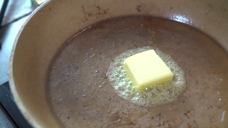 Butter-Melting-In-Frying-Pan-Overhead-Shot