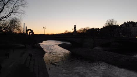 Sunset-view-of-a-bridge-on-Isar-river-Munich-Germany