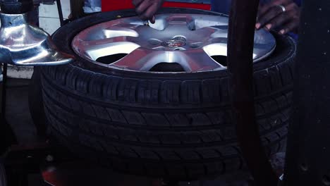 At-the-tire-center-having-a-tire-fixed-and-put-back-together