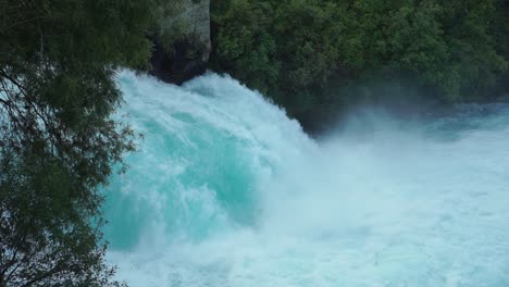 SLOWMO---Close-up-Pan-of-raging-Huka-Falls,-New-Zealand