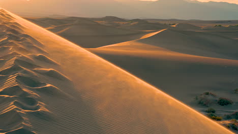 Sand-Dunes-blowing-by-wind-on-the-top-of-the-mountain-at-the-desert