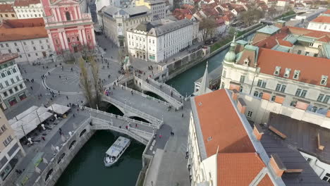 Aerial-view-of-Tromostovje,-Triple-Bridge-of-Ljubljana-on-the-river-Ljubljanica,-center-of-the-city