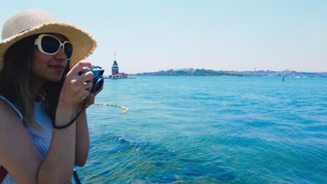 Slow-motion:Beautiful-girl-takes-pictures-of-Bosphorus,a-popular-destination-in-Uskudar-town,Istanbul,Turkey