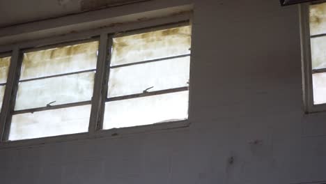Panning-shot-of-windows-in-an-old-building