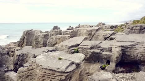 Drone-view-of-the-pancake-rocks-at-Dolomite-point,-Punakaiki,-New-Zealand
