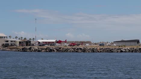 Red-helicopter-landing-at-Robben-Island-Helicopter-Flights