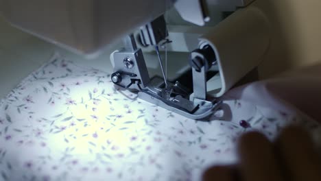 close-up-footage-of-sewing-machine-at-night-time