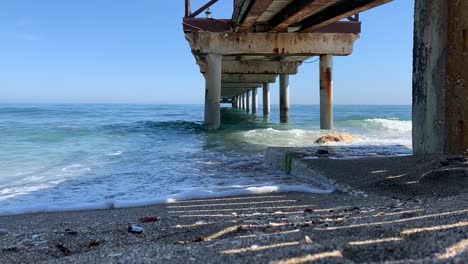 timelapse-of-summer-beach-under-pier-in-golden-mile-marbella,malaga,-spain