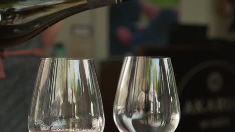 SLOWMO---Pouring-glasses-of-white-wine