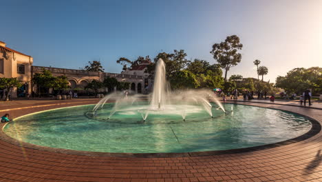 Time-lapse-of-fountain-and-people-at-Balboa-Park,-San-Diego,-California,-taken-during-blue-sky-and-afternoon-hours