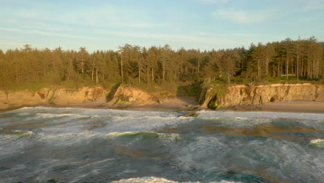 Drone-flying-sideways-over-ocean-near-Yoakam-Point-at-the-Oregon-Coast