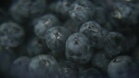 higher-contrast-version,-macro-close-up-blueberries-spinning-in-water,-perfect-shot-for-refreshing-drink-commercials-or-cooking-ingredient-introduction