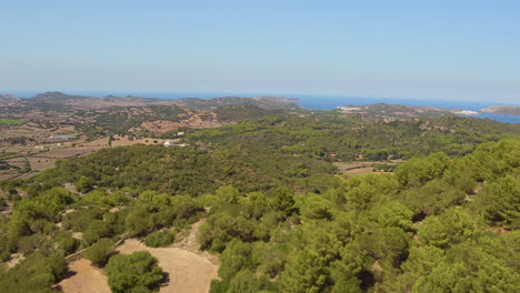 Aerial-view-flying-through-scrubland-at-Monte-Toro-on-the-Spanish-Island-of-Menorca