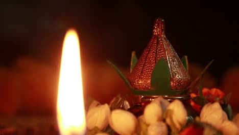 Small-light-burning-on-a-table-decorated-for-pooja
