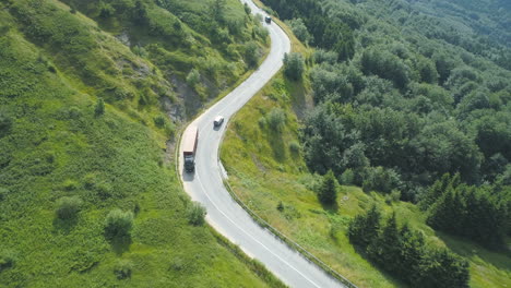 Aerial-view-of-Truck-driving-through-mountain-pass