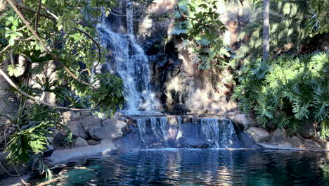 Slo-Mo-of-stunning-waterfall-flowing-into-green-peaceful-pond,-Toowoomba-Queensland