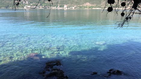 Morning-sun-reflecting-on-water-in-Herceg-Novi,-Montenegro