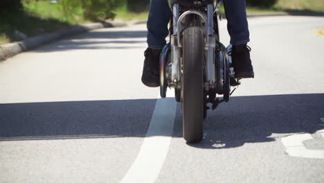 Slow-Motion-Close-Up-of-Motorcycle-Wheel-While-Riding