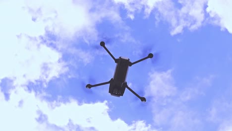 Shot-of-a-drone-in-slowmotion-from-under-it