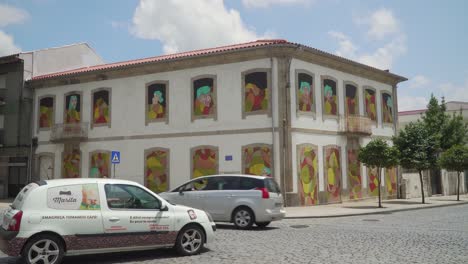 "O-Manto",-colorful-street-art-graffiti-made-by-Ricardo-Miranda-and-Joana-Brito-in-"A-casa-ao-Lado",-Famalicão,-Portugal
