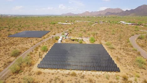 Aerial-descent-on-solar-panels-array-panels-in-the-Sonoran-desert-near-Taliesin-West,-Scottsdale,-Arizona-Concept:-environment,-alternative-energy,-solar-power
