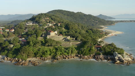Famous-landmark-brazilian-fortress-at-sunset,-Fortaleza-Sao-Jose-Da-Ponta-Grossa,-Jurere-Internacional,-Florianopolis,-Santa-Catarina,-Brazil