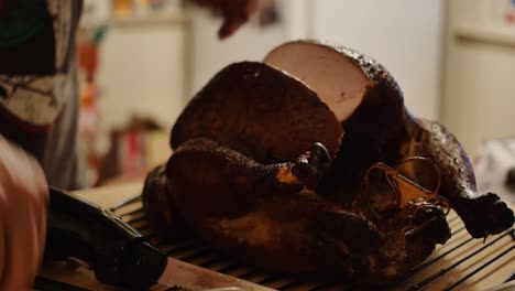 A-big-chunk-of-thanksgiving-turkey-is-taken-off-carcass-with-electric-knife