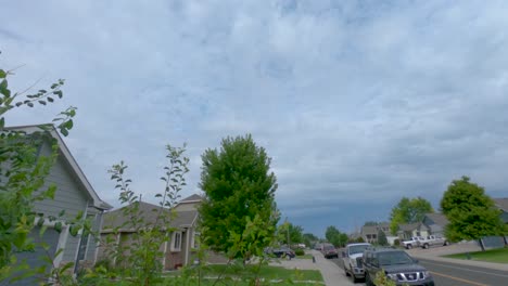 Time-lapse-of-clouds-rolling-through-suburban-neighborhood