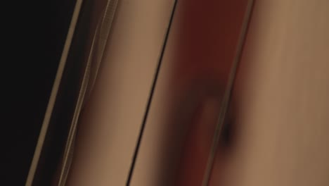macro-close-up-of-cello,-cello-bow-,-cello-playing-and-strings-music-video,-cello-player