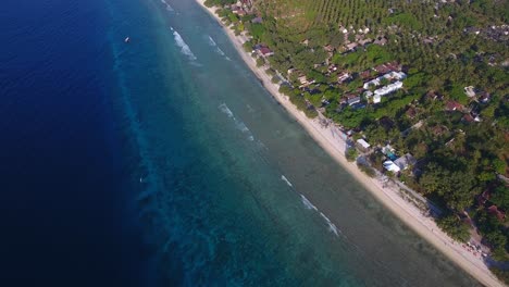 aerial-footage-view-coming-down-towards-Gili-Trawangan-beach,-tropical-islands-of-Lombok-Bali-Indonesia