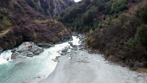 Low-flying-aerial-shot-of-Skippers-canyon-and-Shotover-River-in-Queenstown,-Central-Otago,-New-Zealand