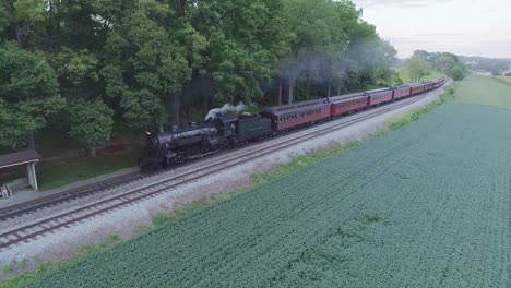 Aerial-View-on-an-Approaching-Steam-Passenger-Train-in-the-Amish-Countryside-on-a-Summer-Day