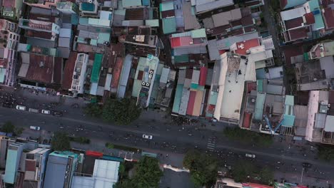 Afternoon-drone-flight-over-the-rooftops-of-Binh-Thanh-district,-featuring-a-Catholic-Church-in-a-densely-populated-area-of-Ho-Chi-Minh-City-or-Saigon-Vietnam