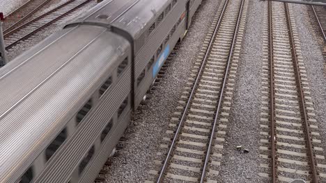 overhead-shot-of-passenger-train-in-rail-yard-4k