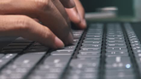 Super-Close-Shot-of-Female-Hands-Typing-on-a-Laptop-Computer