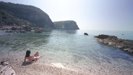 Skinny-lady-in-her-red-bikinis-on-the-coast-of-Montenegro-on-sunny-summers-days