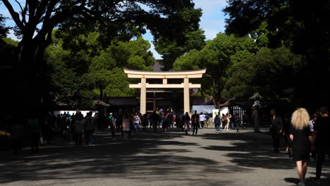 A-big-torii-gate-marking-the-entry-to-Meiji-Jingu-Shrine-grounds-in-Yoyogi-park,-Tokyo