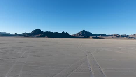 Flying-over-the-Bonneville-Salt-Flats-in-Northwestern-Utah-reveal-white-salt-and-tire-tracks