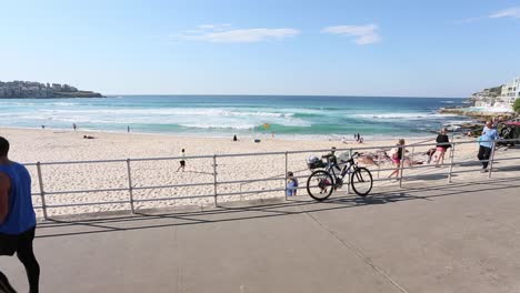 People-of-all-ages-enjoying-a-walk-on-the-Promenade-at-Bondi-Beach,-Sydney-Australia-in-Springtime