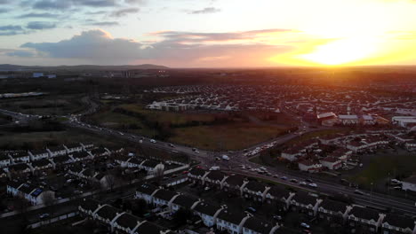 Aerial---A-residential-of-Lucan,-a-magic-hour-cold-day-with-a-sunset-view-from-above-of-the-houses-and-traffics