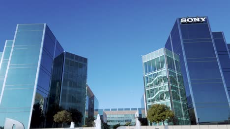 Look-up-at-Sony-Interactive-Entertainment-offices-in-Silicon-Valley,-Foster-city-in-front-of-Logo-and-fountain