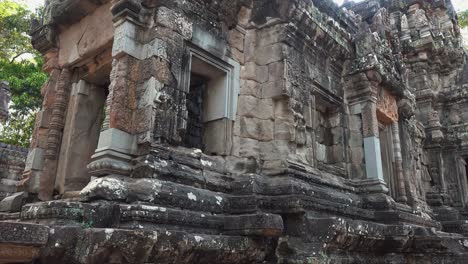 Close-Exterior-Pan-Shot-of-Temple-Built-by-Stone-Blocks-in-the-Ancient-Times-Near-Angkor-Wat