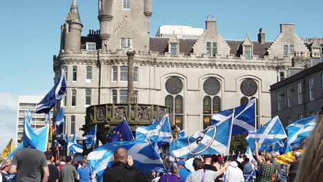 Slow-motion-of-a-crowd-of-Pro-Scottish-Independence-supporters-gather-around-the-Aberdeen-Mercat