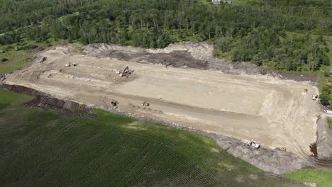 Aerial-circling-shot-of-a-construction-site-on-a-farm