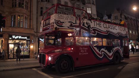 London-tourists-on-classical-open-top-tour-bus-in-Kensington