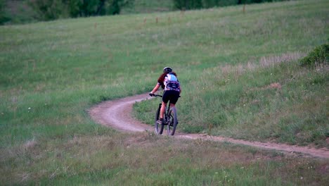 Mountain-biker-riding-in-trail-in-slow-motion